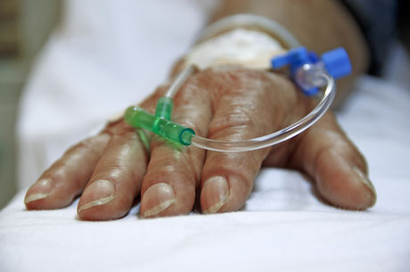 Close up shot of IV in older person&#039;s hand